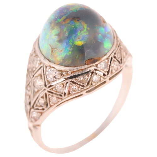 1102 - An Art Deco platinum black opal and diamond ring, centrally set with round high cabochon black opal ... 