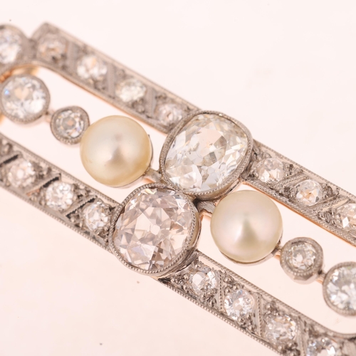 1104 - A Belle Epoque Edwardian natural pearl and diamond brooch, set with 5.5mm and 5.3mm button pearls se... 