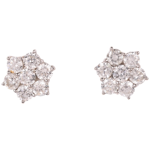 1107 - A pair of 18ct gold diamond flowerhead cluster stud earrings, set with modern round brilliant-cut di... 