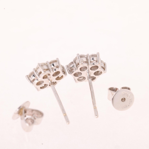 1107 - A pair of 18ct gold diamond flowerhead cluster stud earrings, set with modern round brilliant-cut di... 