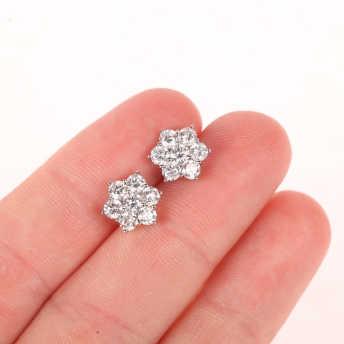 1107 - A pair of 18ct gold diamond flowerhead cluster stud earrings, set with modern round brilliant-cut di... 