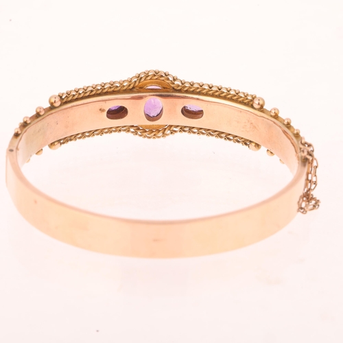 1110 - An Antique 9ct rose gold amethyst and split pearl Etruscan Revival hinged bangle, maker JS, Birmingh... 