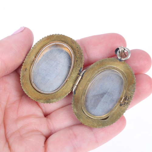 1114 - An Antique Japanese Meiji Period Shakudo locket pendant, circa 1890, with applied gold and silver de... 