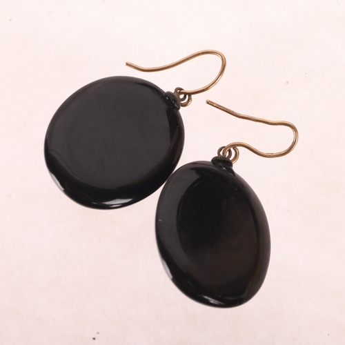 1115 - A pair of Victorian Whitby Jet drop earrings, relief carved floral decoration, with shepherd hook fi... 