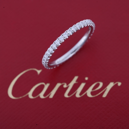 1124 - CARTIER - an 18ct white gold diamond Etincelle De Cartier full eternity wedding band ring, ref. CRB4... 