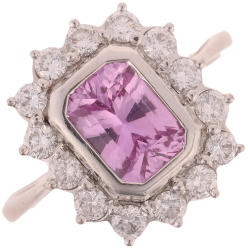 1129 - An 18ct white gold pink sapphire and diamond cluster ring, by Pravins, London 2010, rub-over set wit... 