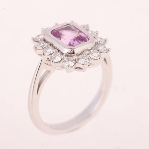 1129 - An 18ct white gold pink sapphire and diamond cluster ring, by Pravins, London 2010, rub-over set wit... 