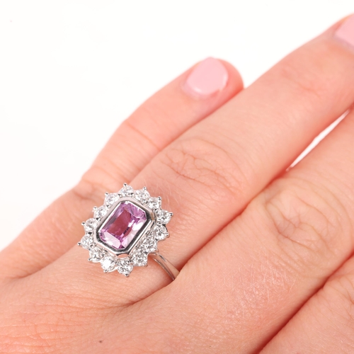 1129 - An 18ct white gold pink sapphire and diamond cluster ring, by Pravins, London 2010, rub-over set wit... 