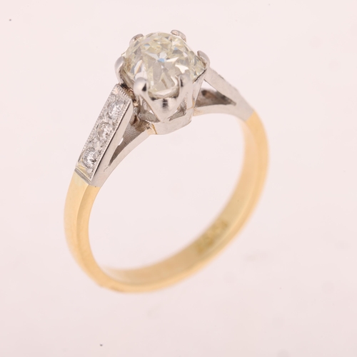 1132 - An 18ct gold 1ct single stone diamond ring, claw set with old mine-cut diamond flanked by modern rou... 