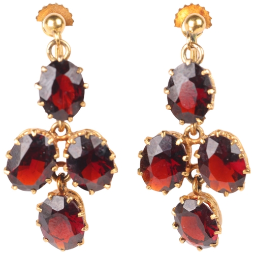 1143 - A pair of 9ct gold garnet drop earrings, set with oval mixed-cut garnets with screw-back fittings, 3... 