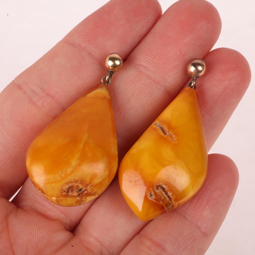 1144 - A pair of 9ct gold butterscotch amber drop earrings, with stud fittings, 43mm, 7.3g