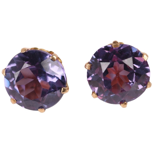 1148 - A pair of 14ct gold synthetic colour change sapphire stud earrings, unmarked mount tests as 14ct, 7.... 