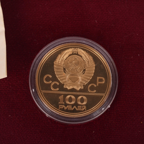 1153 - A 21.6ct (900 fine) gold USSR 'Lenin Stadium - Moscow 1980 Olympics' 100 roubles commemorative coin,... 