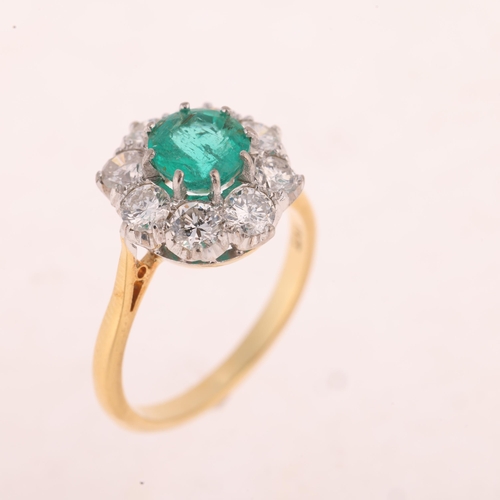 1167 - An 18ct gold emerald and diamond flowerhead cluster ring, set with round-cut emerald and modern roun... 