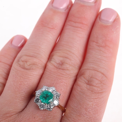 1167 - An 18ct gold emerald and diamond flowerhead cluster ring, set with round-cut emerald and modern roun... 