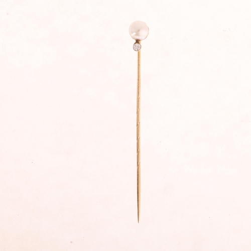 1169 - A 14ct gold whole pearl and diamond stickpin, set with 5.6mm pearl and modern round brilliant-cut di... 