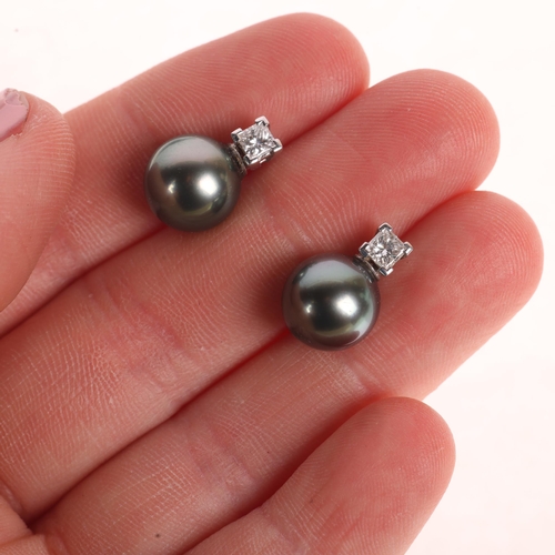 1171 - A Pair of Black Cultured Pearl and Diamond Stud Earrings,

each comprising a Princess-cut diamond su... 