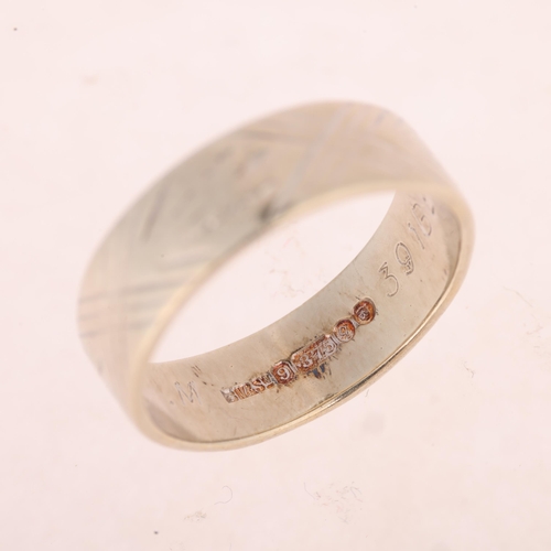 1186 - A 9ct white gold wedding band ring, maker BW & Sons, London 1971, engraved decoration, band width 6m... 