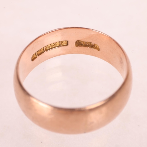 1190 - A 9ct rose gold wedding band ring, maker WKK, Birmingham 1915, band width 7.8mm, size V, 6.6g