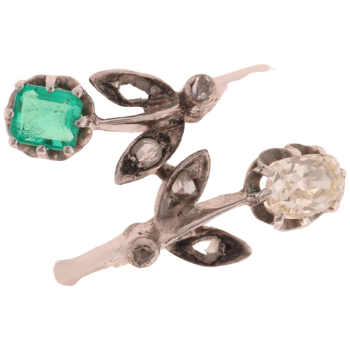 1195 - An 18ct white gold emerald and diamond crossover ring, floral design set with 0.5ct oval old-cut dia... 