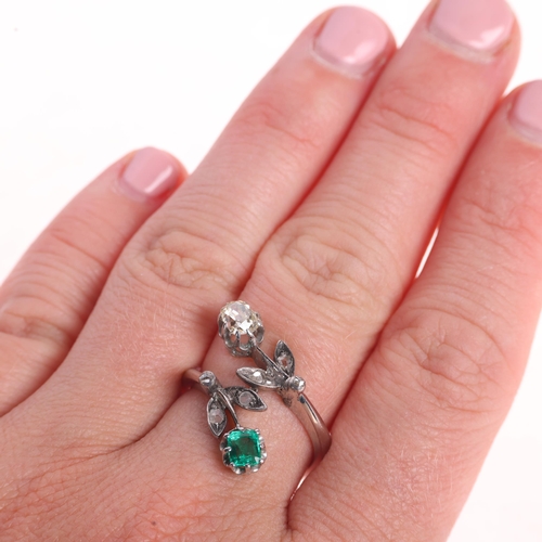 1195 - An 18ct white gold emerald and diamond crossover ring, floral design set with 0.5ct oval old-cut dia... 