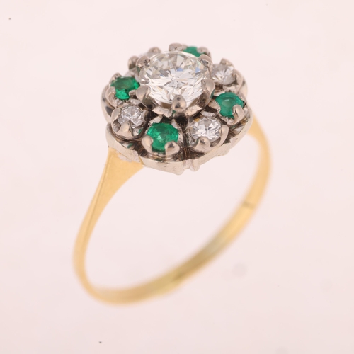 1203 - An 18ct gold emerald and diamond flowerhead cluster ring, set with round-cut emeralds and modern rou... 
