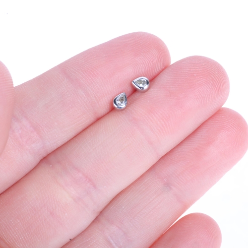 1207 - A pair of 18ct white gold diamond stud earrings, set with pear-cut diamonds, total diamond content a... 