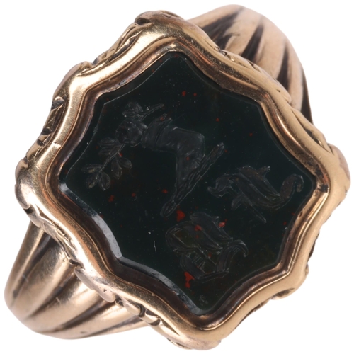 1210 - An Antique 9ct gold bloodstone seal signet ring, intaglio carved with hand holding olive branch embl... 