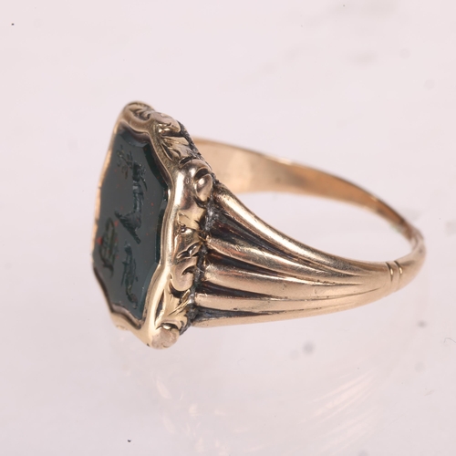 1210 - An Antique 9ct gold bloodstone seal signet ring, intaglio carved with hand holding olive branch embl... 