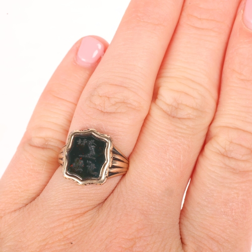 1210 - An Antique 9ct gold bloodstone seal signet ring, intaglio carved with hand holding olive branch embl... 