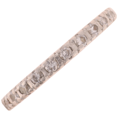 1213 - A platinum diamond half eternity band ring, set with modern round brilliant-cut diamonds, total diam... 