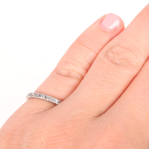 1213 - A platinum diamond half eternity band ring, set with modern round brilliant-cut diamonds, total diam... 