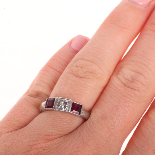 1215 - A platinum three stone ruby and diamond ring, rub-over set with 0.7ct Princess-cut diamond, colour a... 