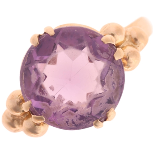 1217 - A 9ct gold single stone amethyst dress ring, maker EFC, Birmingham 1970, claw set with round-cut ame... 