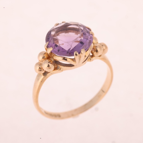 1217 - A 9ct gold single stone amethyst dress ring, maker EFC, Birmingham 1970, claw set with round-cut ame... 