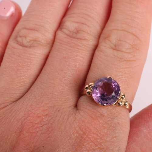1217 - A 9ct gold single stone amethyst dress ring, maker EFC, Birmingham 1970, claw set with round-cut ame... 