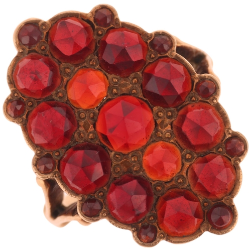 1218 - A 14ct gold Bohemian garnet plaque ring, pave set with rose-cut garnets, unmarked mount tests as 14c... 