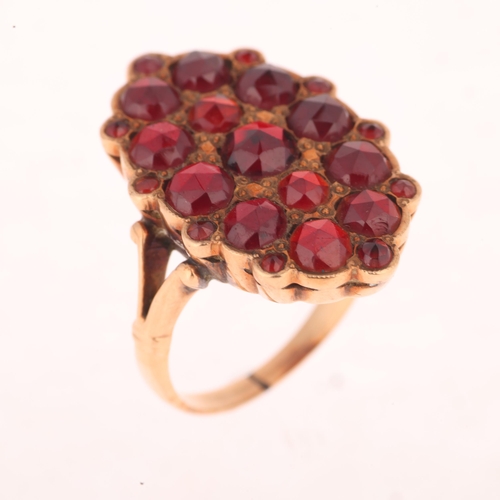 1218 - A 14ct gold Bohemian garnet plaque ring, pave set with rose-cut garnets, unmarked mount tests as 14c... 
