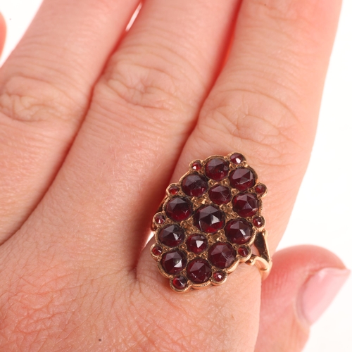 1218 - A 14ct gold Bohemian garnet plaque ring, pave set with rose-cut garnets, unmarked mount tests as 14c... 