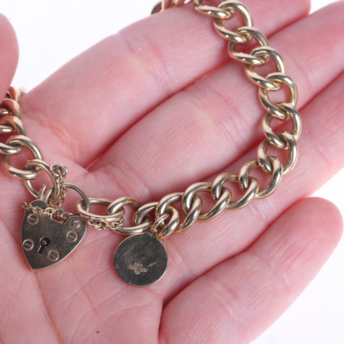 1222 - A 9ct gold solid curb link chain bracelet, maker AWF, Birmingham 1996, with 9ct heart padlock clasp ... 