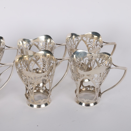 1545 - A set of 6 George V silver drinking tot holders, Sheffield 1912, 6cm, and a silver oil lamp, 6.5oz t... 