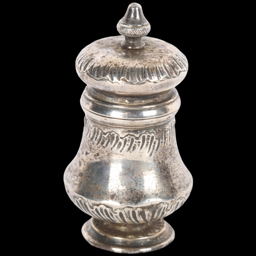 1563 - An Antique French silver peppermill, baluster form with relief embossed decoration, 9cm, 4.1oz gross