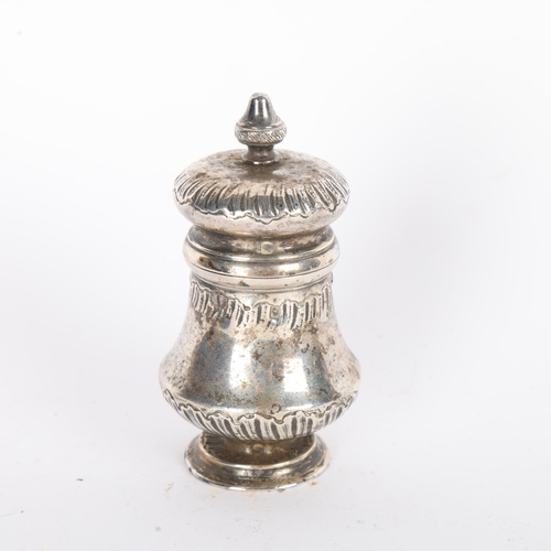 1563 - An Antique French silver peppermill, baluster form with relief embossed decoration, 9cm, 4.1oz gross