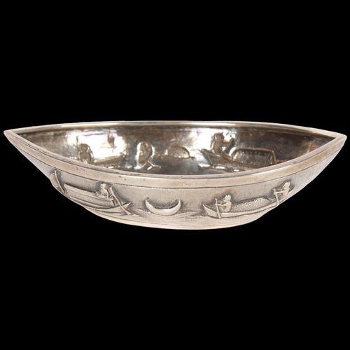 1567 - An Indian silver boat dish, relief embossed decoration, marked T.P. 90, 13 x 7cm, 3.1oz