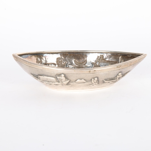 1567 - An Indian silver boat dish, relief embossed decoration, marked T.P. 90, 13 x 7cm, 3.1oz