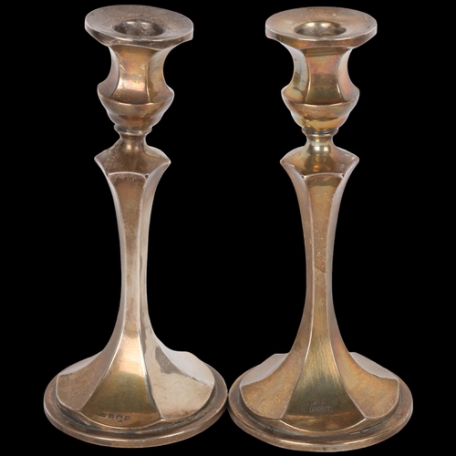 1597 - A pair of George V silver table candlesticks, Charles Edwin Turner, Birmingham 1914, 18cm, loaded ba... 