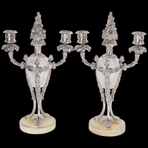 1598 - A pair of 19th Century French silver plated crystal glass candelabra, urn form, each with twin-branc... 