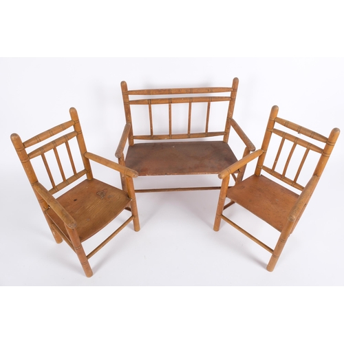 10 - An Antique pine faux bamboo 3-piece doll's furniture set, comprising 2-seater bench, and 2 armchairs... 