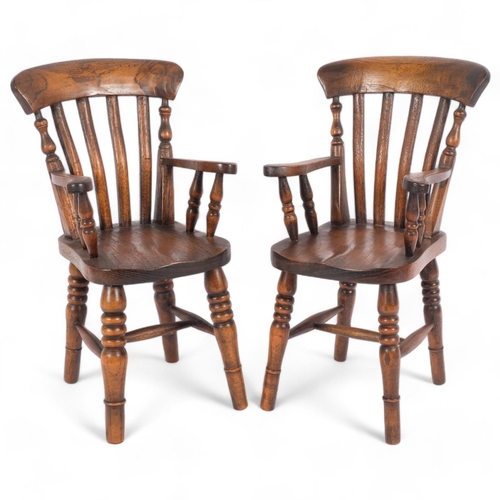 11 - A pair of reproduction elm doll's Windsor armchairs, seat height 15cm