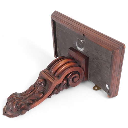 116 - A mahogany wall bracket, with a scrolled acanthus leaf base, H40cm, W38cm, D23cm